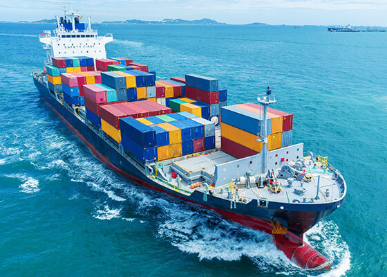 Cargo ship carrying colorful containers on the ocean symbolizing Maritime law